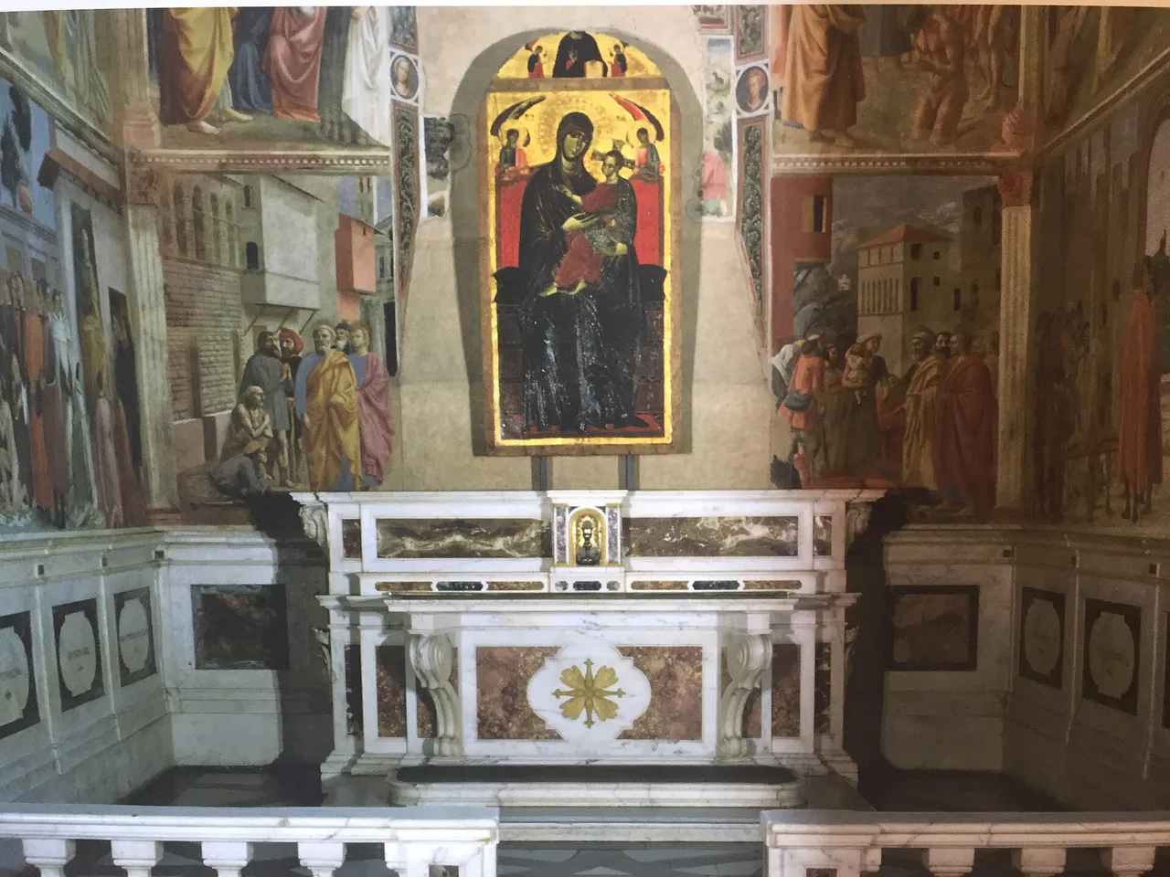 The altar of the Brancacci Chapel with the gold-ground Madonna del Popolo between frescoed walls