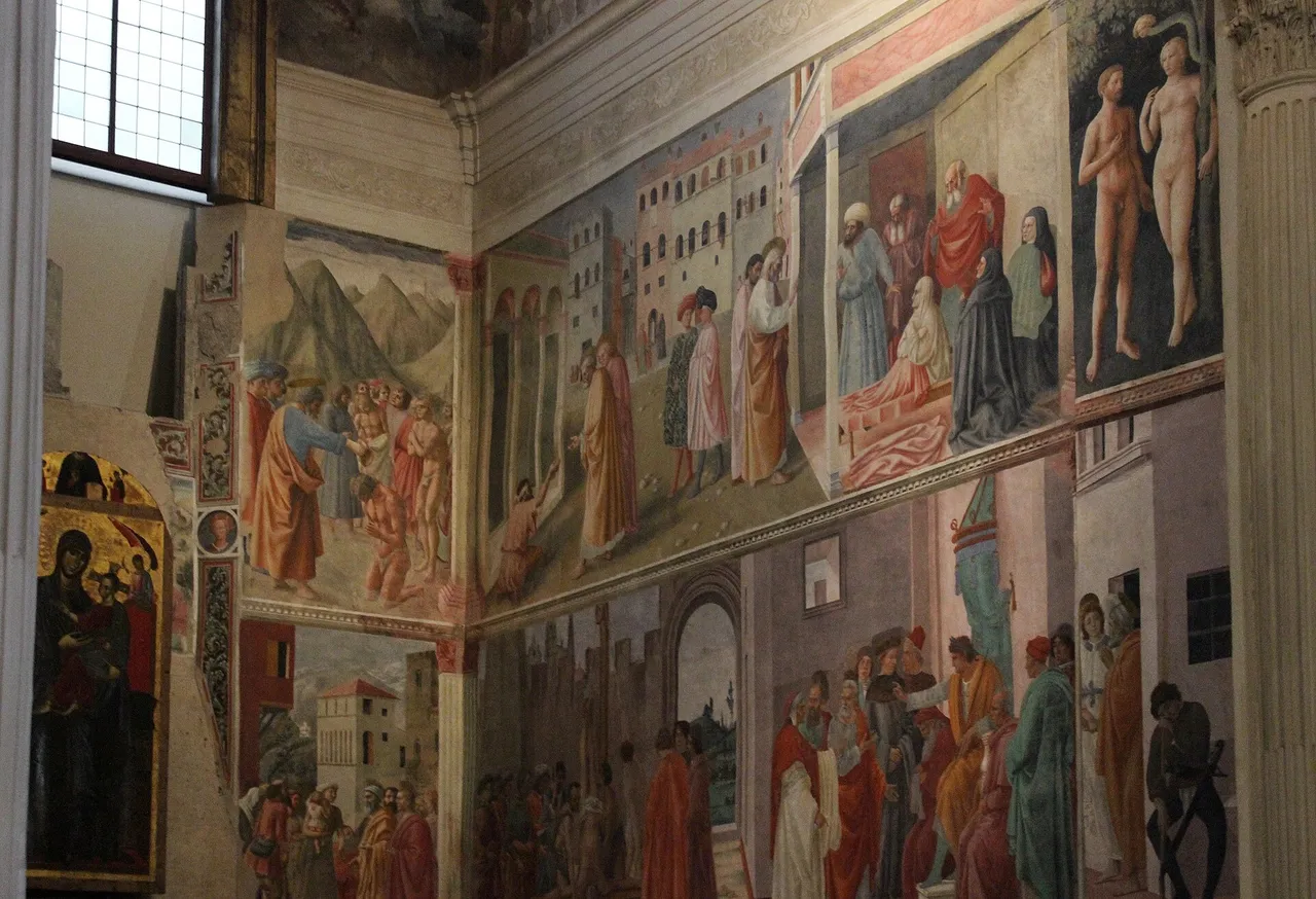 The right-hand wall of the Brancacci Chapel, frescoes in two registers, with the window above